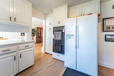 Another view of the kitchen toward the breakfast area and formal dining room.
