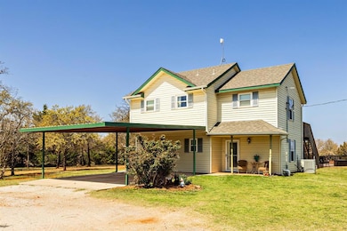 View of front facade featuring roof with shingles,