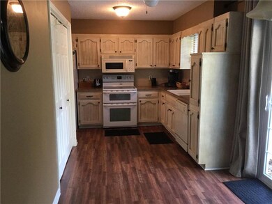Kitchen with laundry and new flooring.