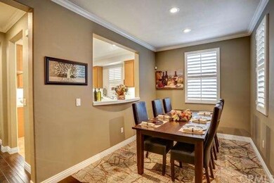 Formal dining area opens to kitchen for entertaini