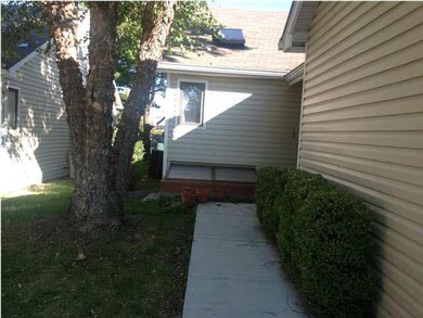 Front walk leading to breezeway between front porc