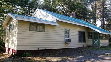 Back view of home, and driveway side.