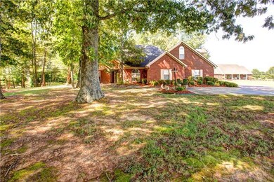 front yard view with large shade trees