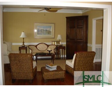 Living Room. Spacious Living Room has crown mouldi