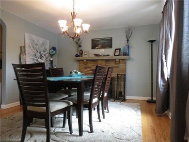The fireplace adds a cozy ambiance to the dining r