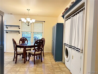 Dining area with an inviting chandelier, light til
