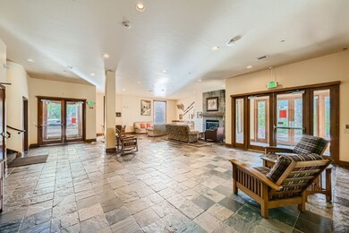 Lobby with comfy couches, game table & gas firepla