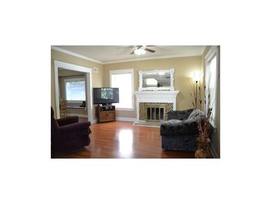 Living room with crown molding.