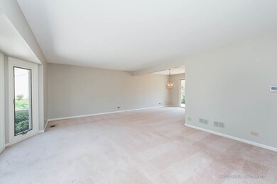 The living room opens into the dining room and off