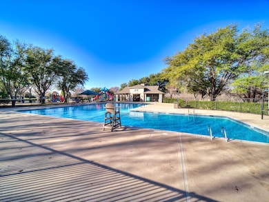 Community pool with a patio area