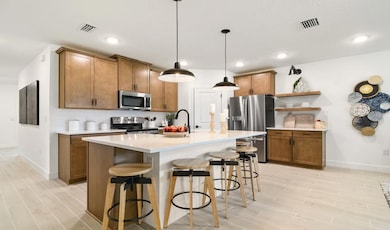 Kitchen with pendant lighting and floating shelves