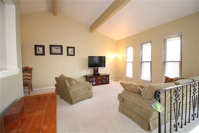 THE LIVING ROOM AREA WHICH IS OPEN TO THE DINING R
