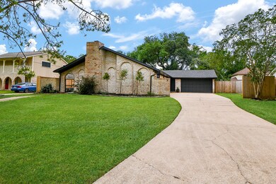 This photo showcases a charming single-story brick