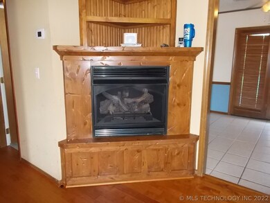 Gas logs fireplace added in corner of living room