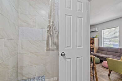 Full bathroom featuring wood finished floors, an 