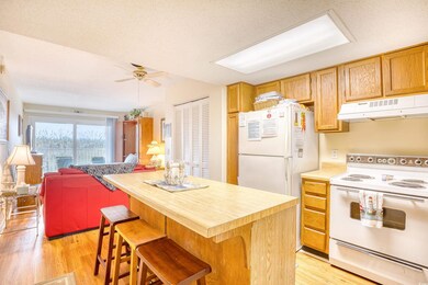 Kitchen featuring a center island, white appliance