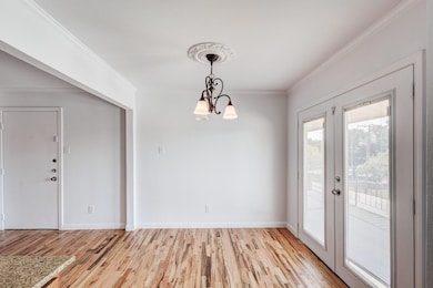 Unfurnished dining area featuring light wood-type 