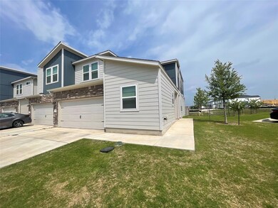 View of side of home featuring an attached garage
