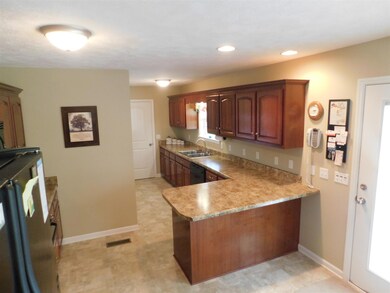 Open Floorpan Kitchen with door leading to relaxing covered patio