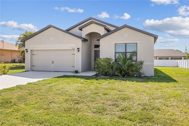 Ranch-style house with an attached garage, stucco