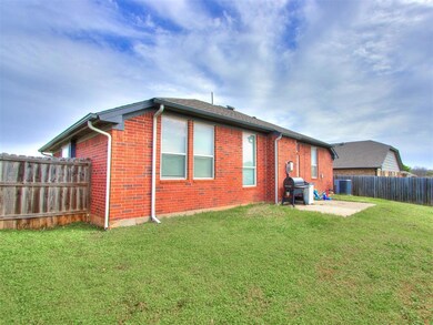 Back of property with a patio and a yard