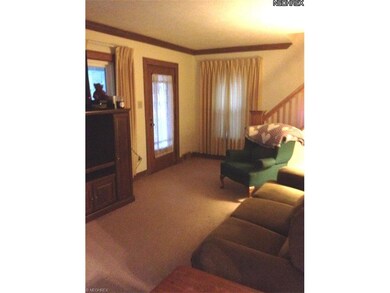 Living room greets you from a relaxing from porch