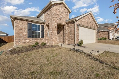 View of front of home featuring a garage and a fro