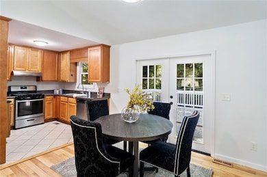 Dining area with french doors opens to the deck