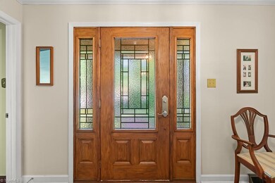 New front door lets the light shine into foyer.