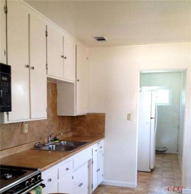 Large  12 x 5 utility room just off the kitchen wi