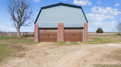 Detached garage/shop with storage above.
