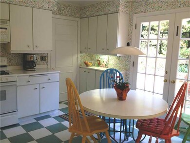 Kitchen. Eating area, doors to patio, more cabinet
