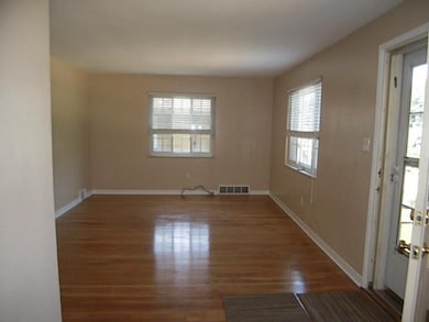 Living Room. Gleaming hardwood floors freshly pain