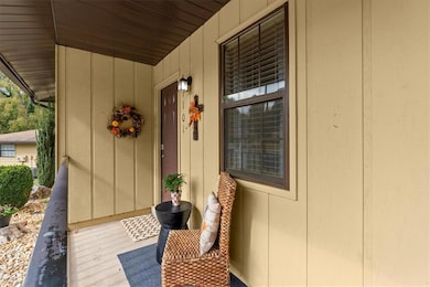 Welcoming front porch invites you to sit and enjoy the views.