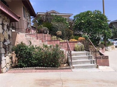 Front yard lanscape and stairway to front entry
