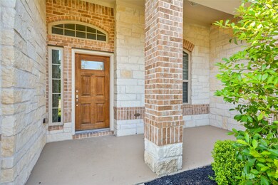 An all natural stone front porch with brick column is where your guests will first note the sheer beauty of this sensational one story David Weekly home. This porch is a perfect place to sit and enjoy chatting with your neighbors.