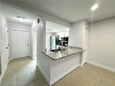 Kitchen featuring stainless steel appliances, ligh