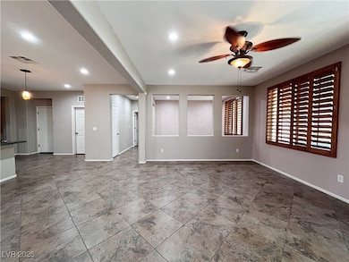 Unfurnished room featuring a ceiling fan and reces