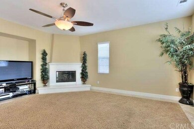Family room with fireplace and inset carpet