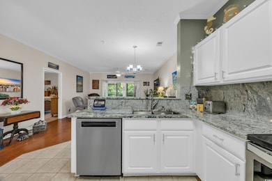 Kitchen featuring light tile patterned floors, vis
