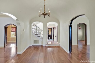 Large welcoming foyer with beautiful wood floors