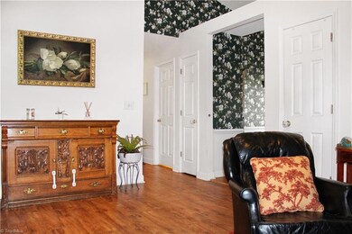 The front door brings you into a large living room with vaulted ceilings.