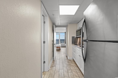 Kitchen with a paneled ceiling, stainless steel ap