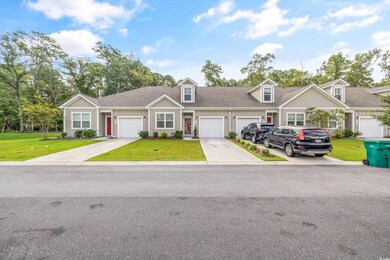 View of front facade featuring a garage and a fron