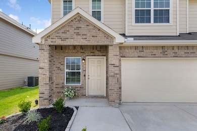 Enjoy a welcoming front porch and beautiful landsc