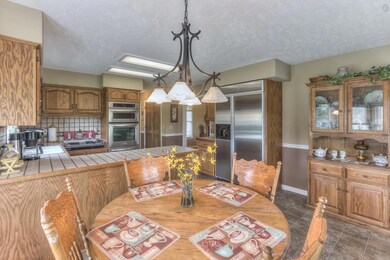 The kitchen also a huge stainless steel side-by-side refrigerator and a large pantry that you can see to the right of the ovens.