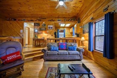 Living room with wood ceiling, light hardwood / wo