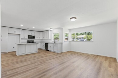 Kitchen featuring stainless steel appliances, base