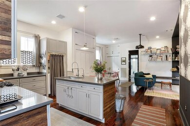 Well equipped kitchen leading to dining and living