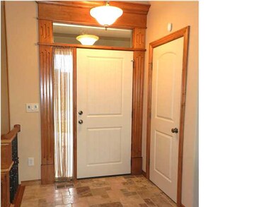THE LOVELY ENTRY HAS CUSTOM MAPLE WOODWORK & BEAUT